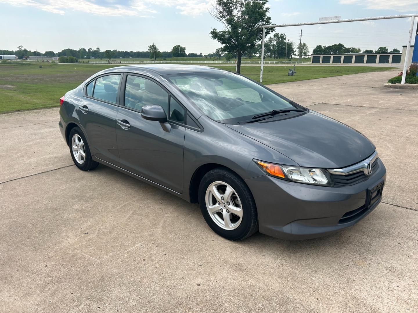 2012 GRAY /Gray Honda Civic CNG Sedan 5-Speed AT (19XFB5F56CE) with an 1.8L L4 SOHC 16V CNG engine, 5-Speed Automatic transmission, located at 17760 Hwy 62, Morris, OK, 74445, (918) 733-4887, 35.609104, -95.877060 - Photo#2